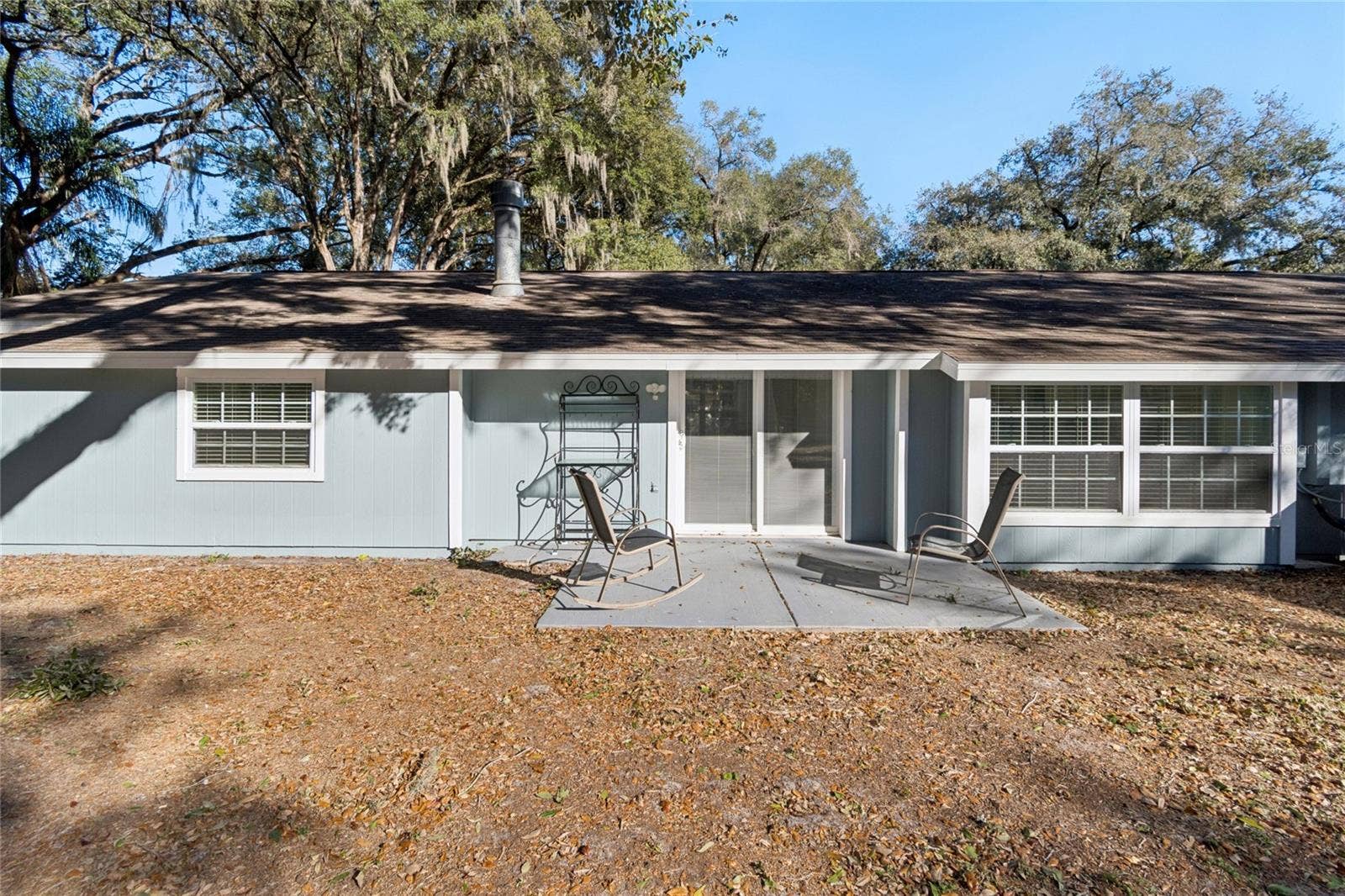 9628 DAVIS ROAD, Tampa, FL 33637 Back of Main House with Sliding Galss Doors to Patio