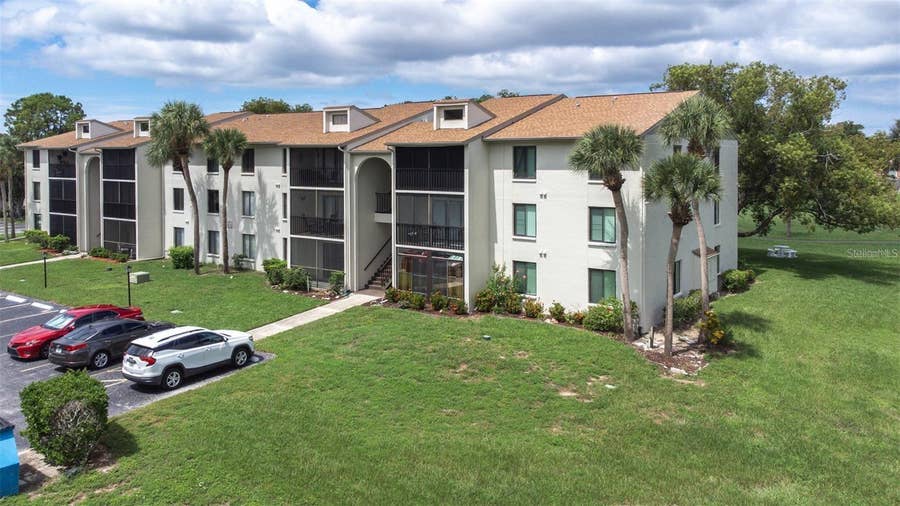 Property photo for 1871 PINE RIDGE WAY W, #H3, Palm Harbor, FL