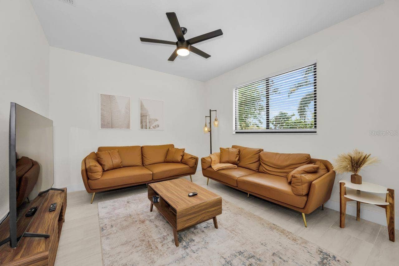 1590 S WASHINGTON AVENUE, Clearwater, FL 33756 Spacious living room with plenty of natural light.