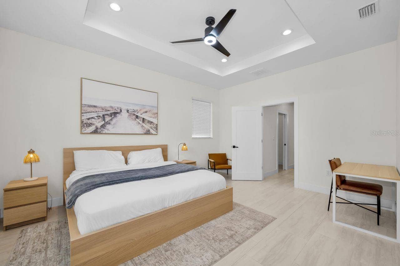 1590 S WASHINGTON AVENUE, Clearwater, FL 33756 A gorgeous primary bedroom with simple and clean lines.