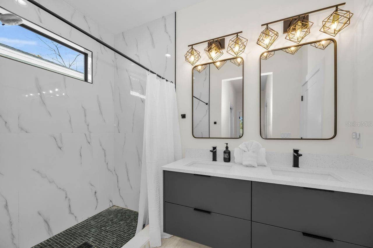 1590 S WASHINGTON AVENUE, Clearwater, FL 33756 Clean, sleek, and modern primary bath