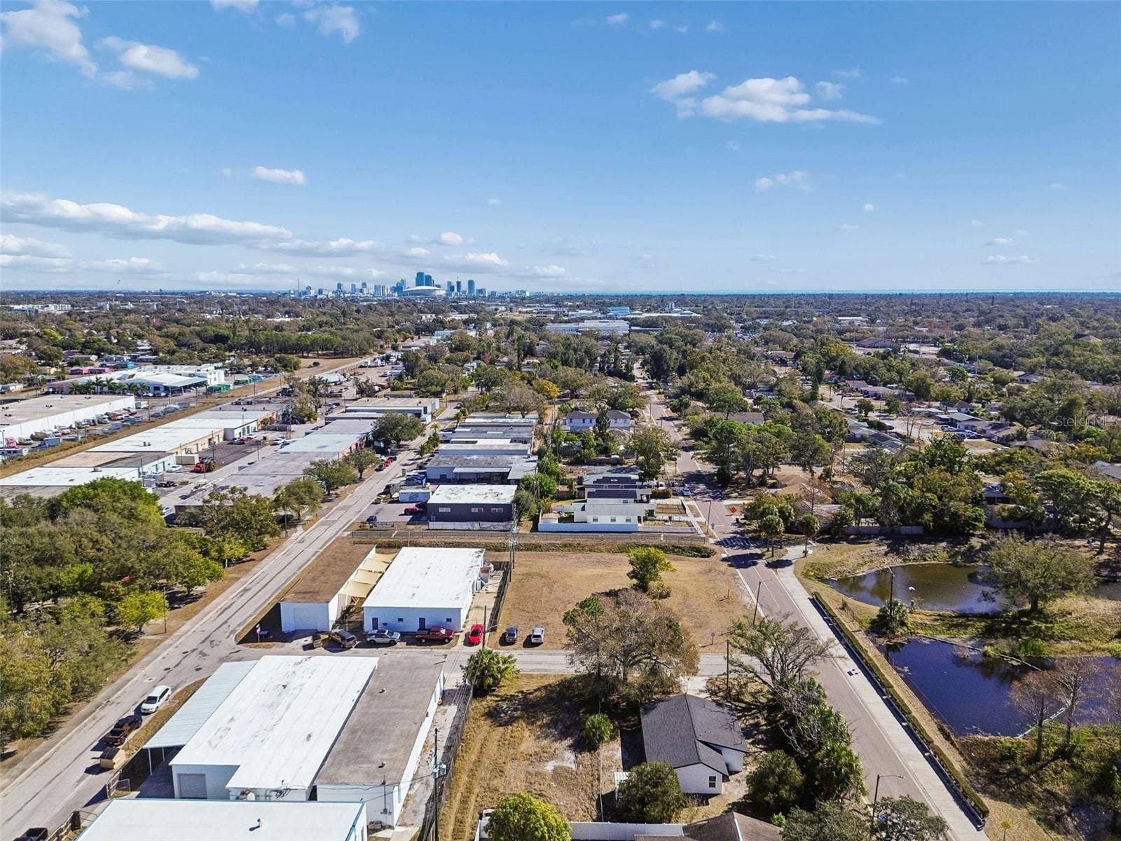 Wide aerial view showing the property's location and convenient access to the surrounding area.