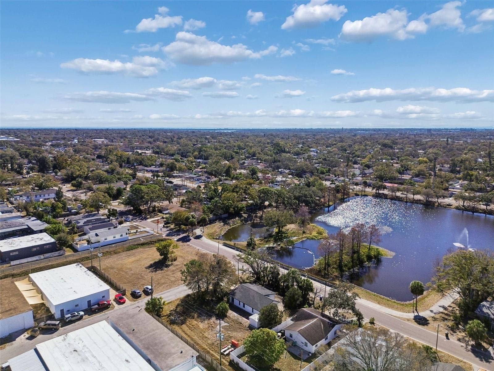 Neighborhood aerial showing nearby residential areas and recreation.
