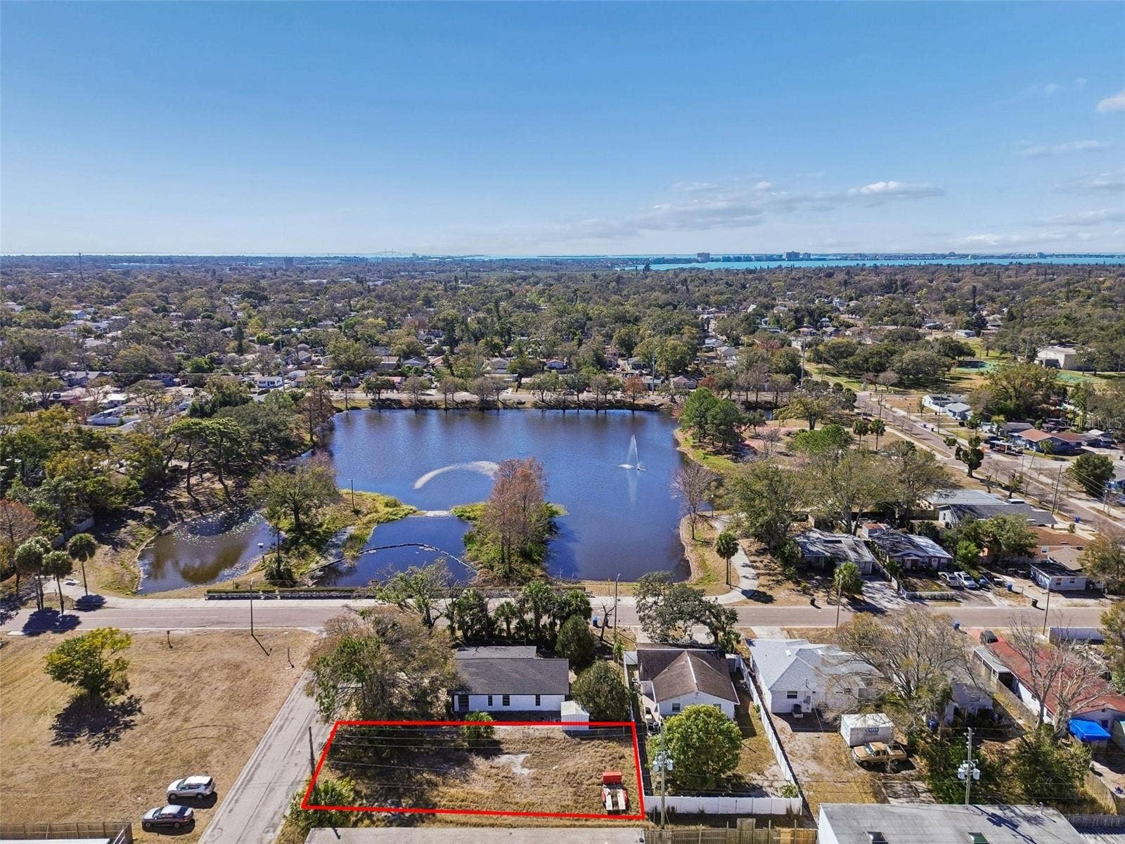 Aerial view with the property outlined, showing the lot and surrounding St. Petersburg neighborhood.