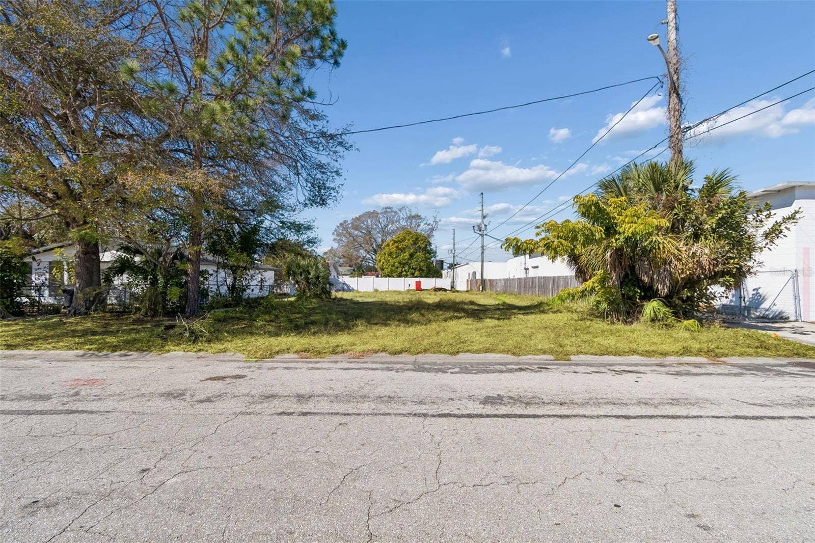 Street view of the vacant lot, ready for someone to imagine a new home taking shape here.