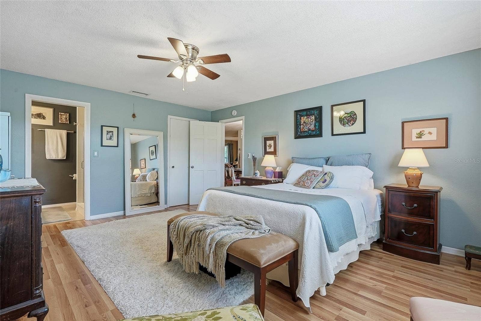 1890 62ND AVENUE S, St Petersburg, FL 33712 Unwind in a generously sized primary suite with warm wood flooring and the everyday convenience of a private ensuite bath.