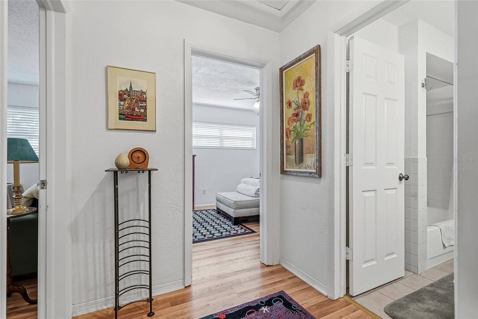 1890 62ND AVENUE S, St Petersburg, FL 33712 Two additional bedrooms and a shared bath are grouped together off their own hallway, creating a comfortable setup for guests or a bedroom and home office.