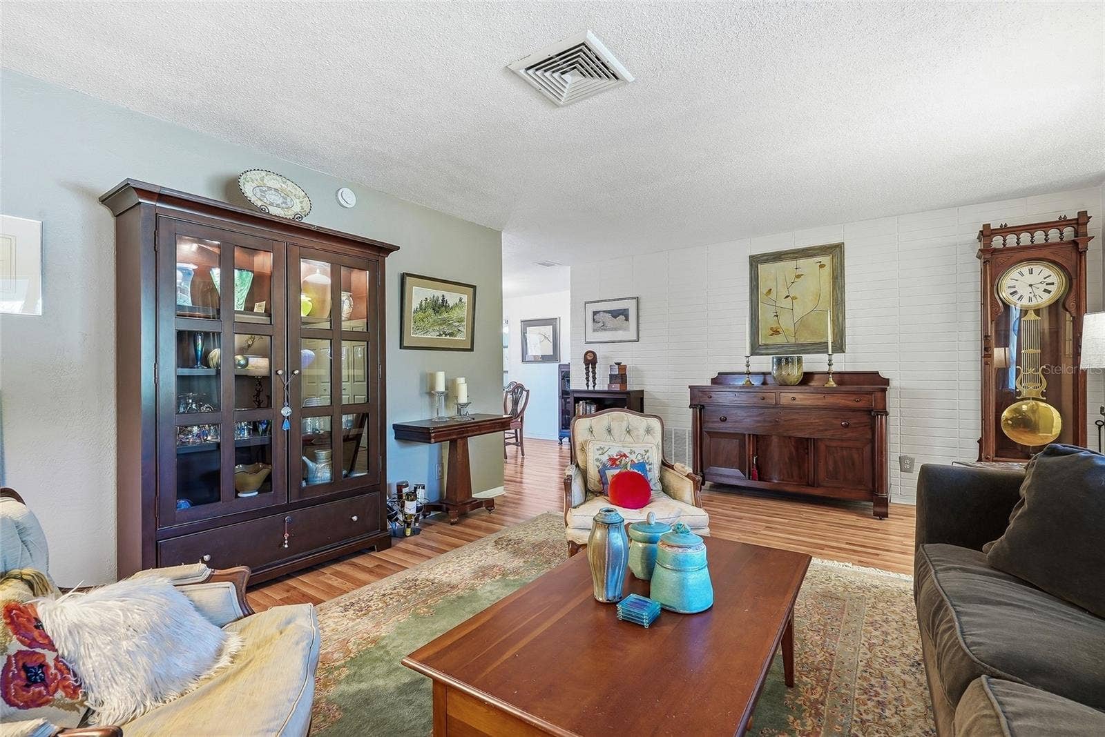 1890 62ND AVENUE S, St Petersburg, FL 33712 A painted brick accent wall adds texture and character, while the nearby dining area keeps entertaining comfortably connected.