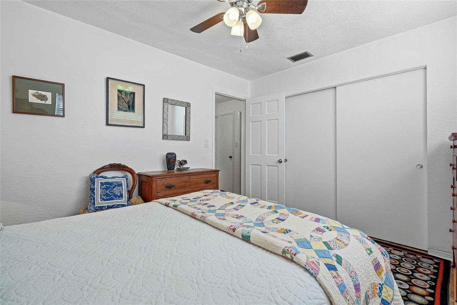 1890 62ND AVENUE S, St Petersburg, FL 33712 A wide closet with sliding doors provides convenient storage while preserving floor space for your bedroom furnishings.