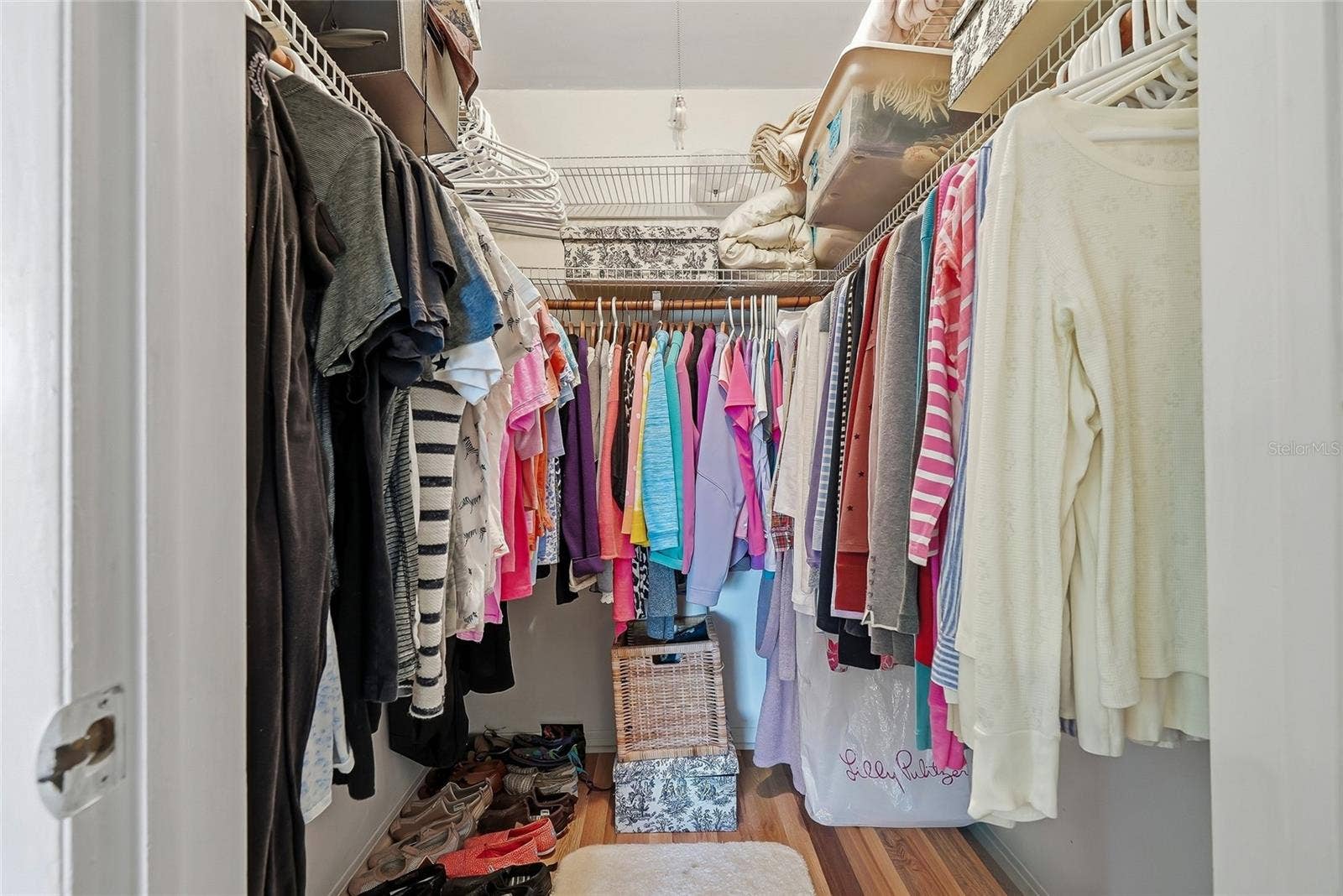 1890 62ND AVENUE S, St Petersburg, FL 33712 Keep your wardrobe within easy reach in a walk-in closet featuring hanging space on three sides and overhead shelving for extra storage.