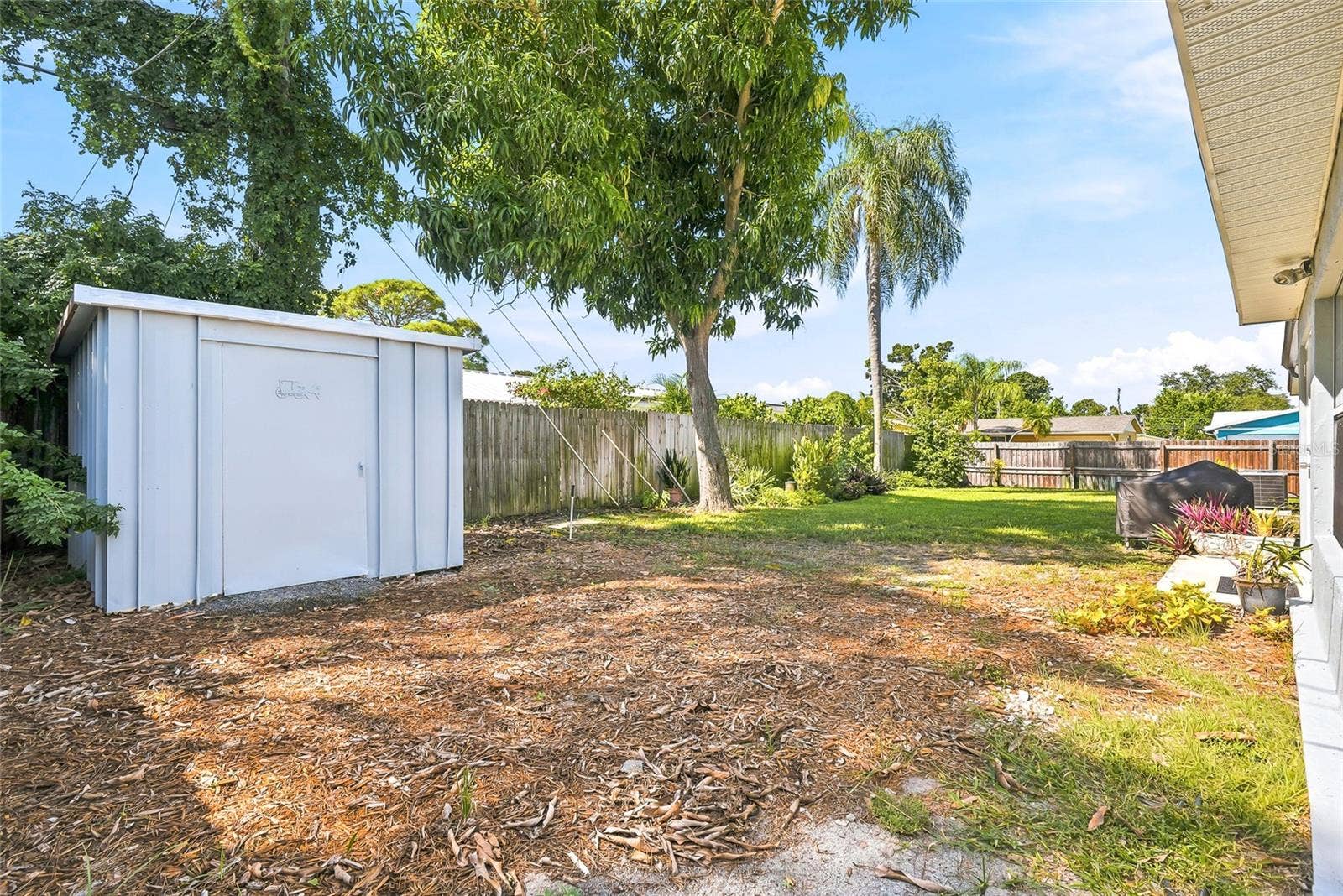 1890 62ND AVENUE S, St Petersburg, FL 33712 A handy backyard shed provides space for gardening tools and outdoor essentials, leaving more room to enjoy your surroundings.