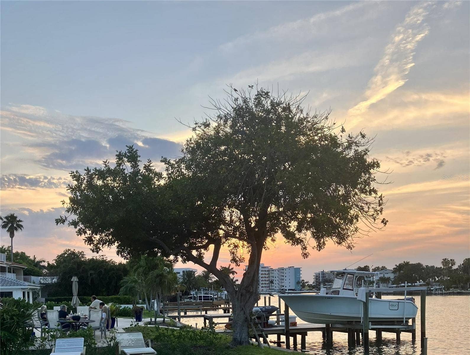 27 DOLPHIN DRIVE, Treasure Island, FL 33706 Enjoy Waterfront, living with tranquil views and colorful sunsets glowing just to the left each evening.