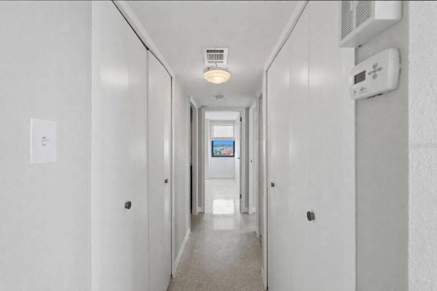 10355 PARADISE BOULEVARD, #608, Treasure Island, FL 33706 Hallway area - closets on both sides plenty of storage
