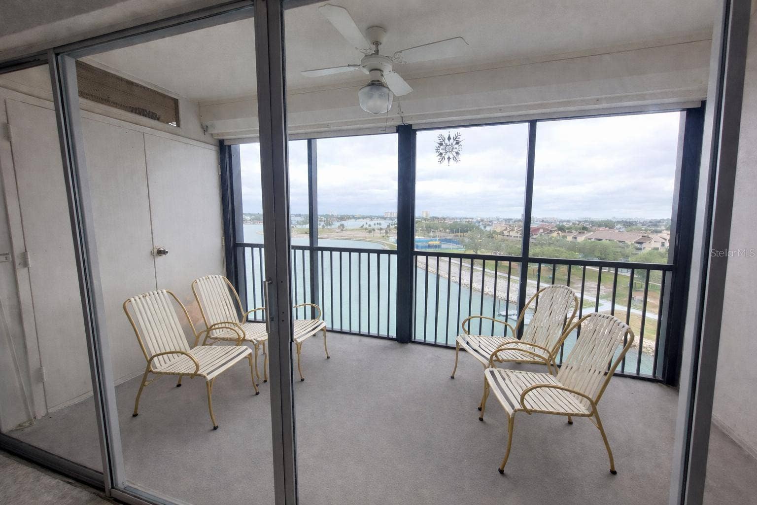 10355 PARADISE BOULEVARD, #608, Treasure Island, FL 33706 Screened balcony with electric hurricane shutters