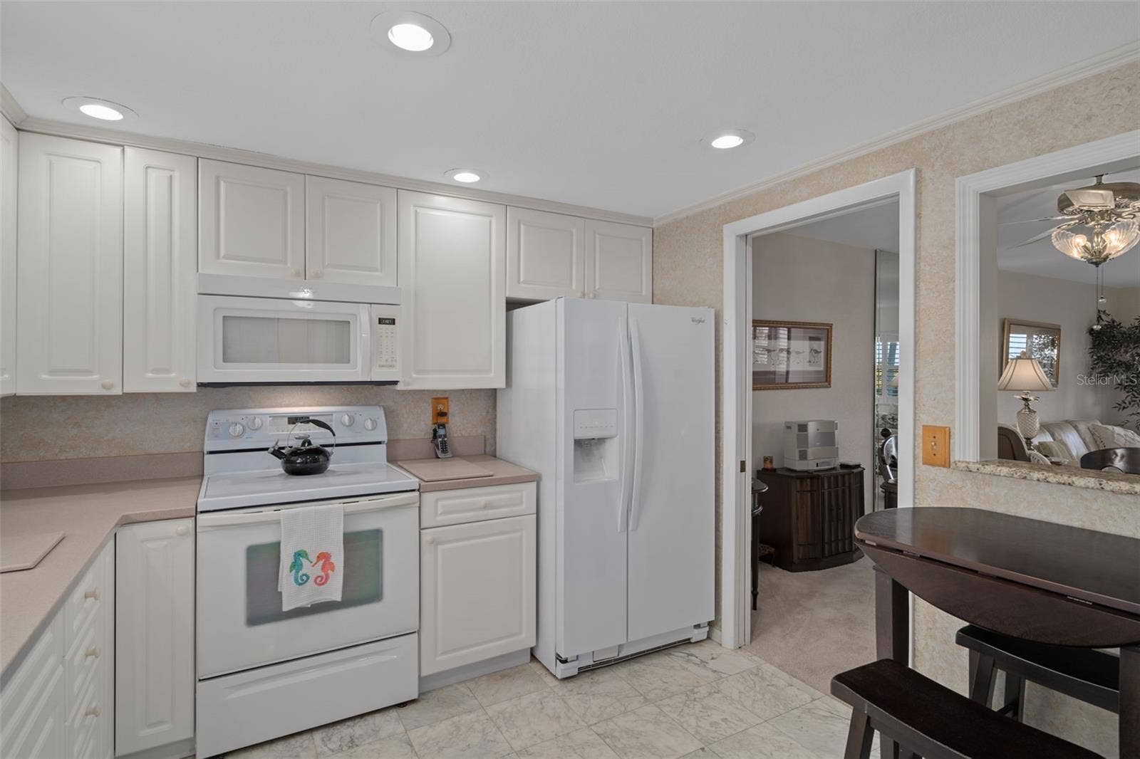 1230 GULF BOULEVARD, #303, Clearwater Beach, FL 33767 Eat-in Kitchen features a small table as well as a pass through to dining area