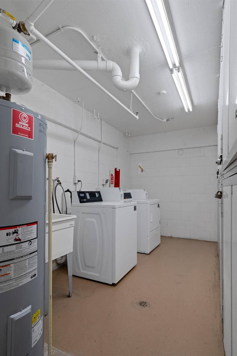 1230 GULF BOULEVARD, #303, Clearwater Beach, FL 33767 Laundry room with trash chute is conveniently located just down the hall on the same floor as unit