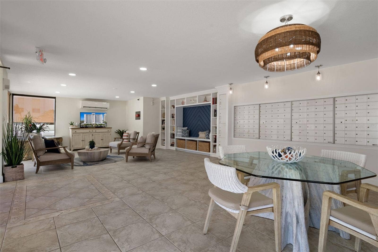 1230 GULF BOULEVARD, #303, Clearwater Beach, FL 33767 Community Mail Room offers several sitting areas and a TV