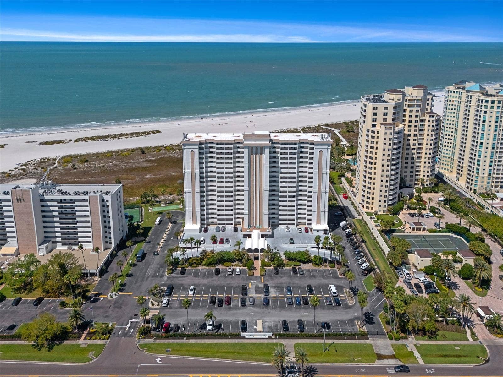 1230 GULF BOULEVARD, #303, Clearwater Beach, FL 33767 Aerial showing other similar residential properties along the beach