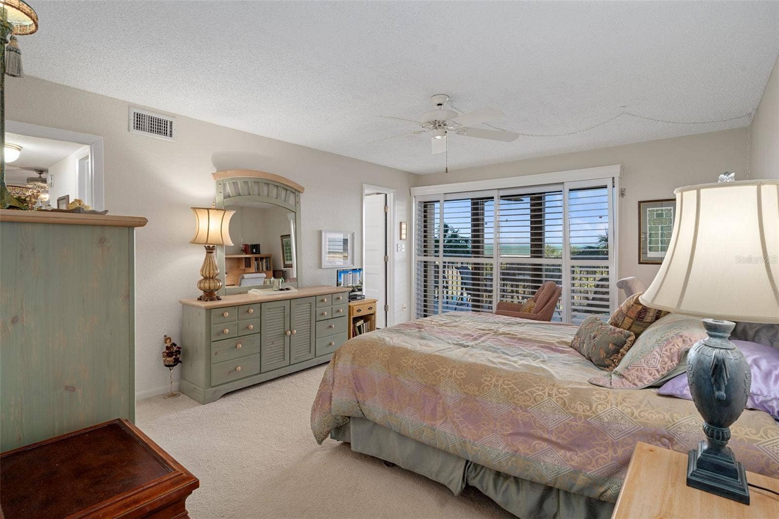 1230 GULF BOULEVARD, #303, Clearwater Beach, FL 33767 Sliding plantation shutters close over the sliding doors when needed