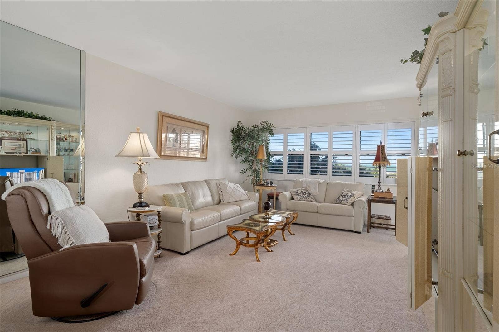1230 GULF BOULEVARD, #303, Clearwater Beach, FL 33767 Cozy living area featuring leather furnishings and a view to the beautiful beach!
