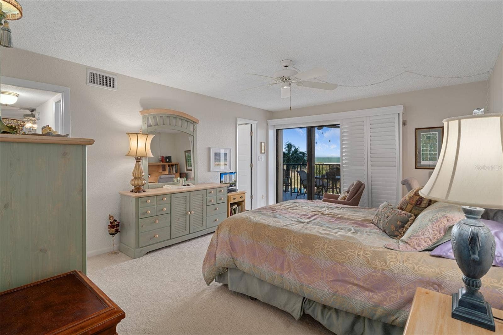 1230 GULF BOULEVARD, #303, Clearwater Beach, FL 33767 Primary suite offers great views and salty breezes through the sliding doors to patio