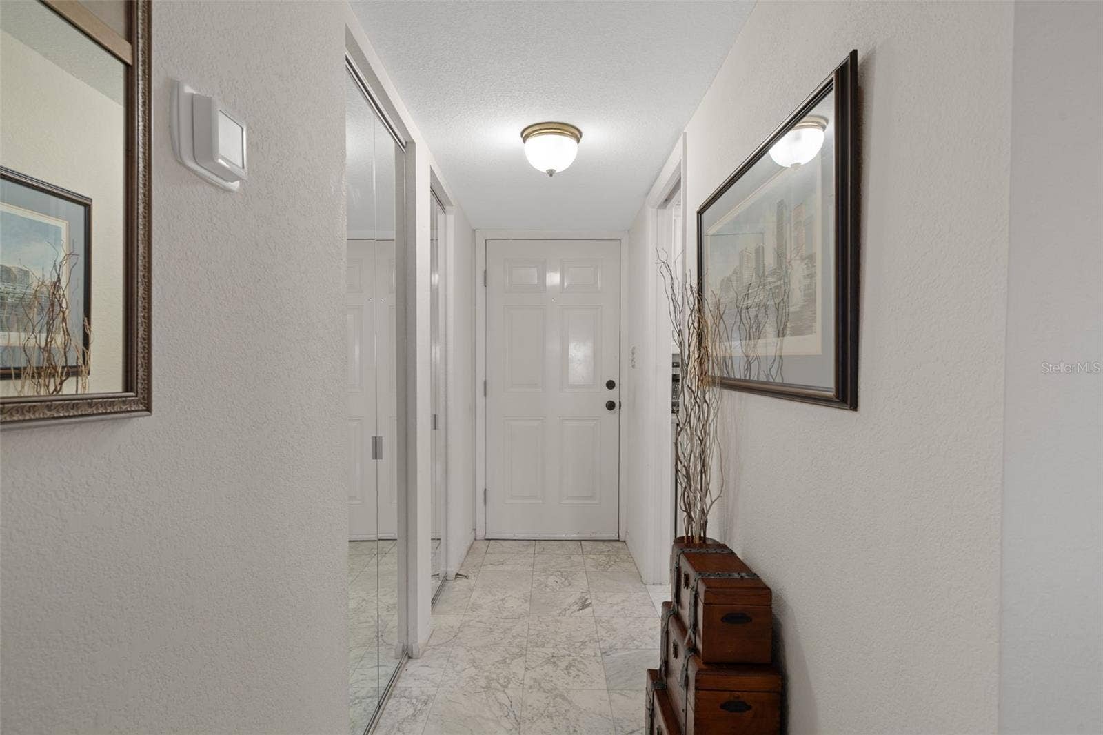 1230 GULF BOULEVARD, #303, Clearwater Beach, FL 33767 Entry foyer with storage closets