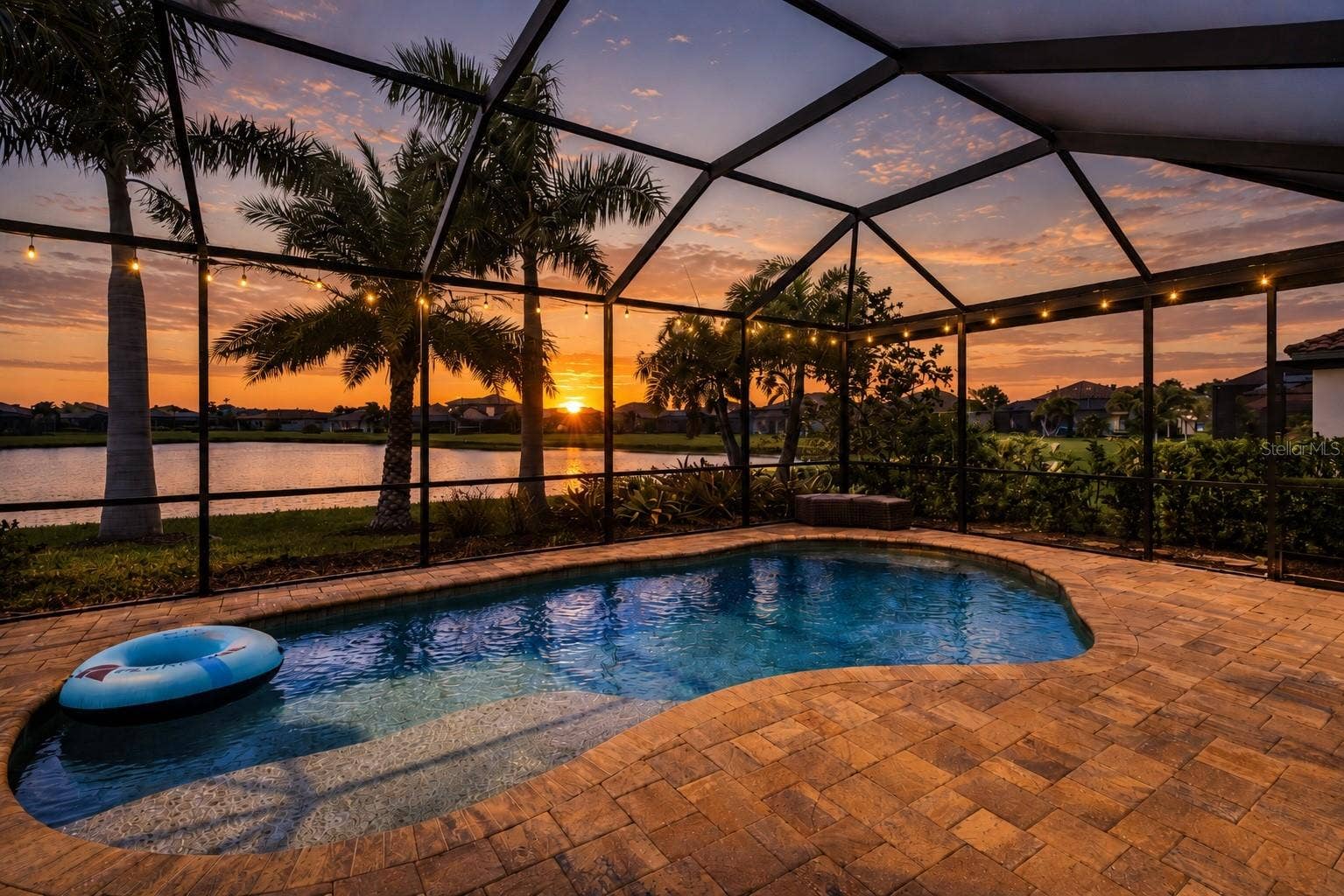 10107 CARNOUSTIE PLACE, Bradenton, FL 34211 Sunset view from the covered lanai