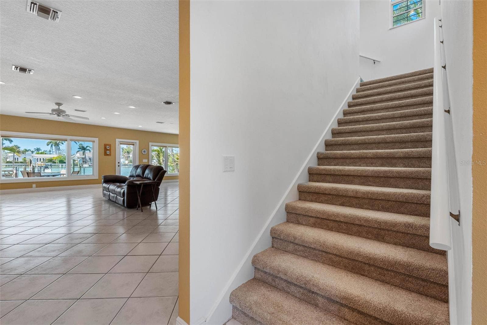 Stairs to the primary suite and office/guest bedroom/nursery.