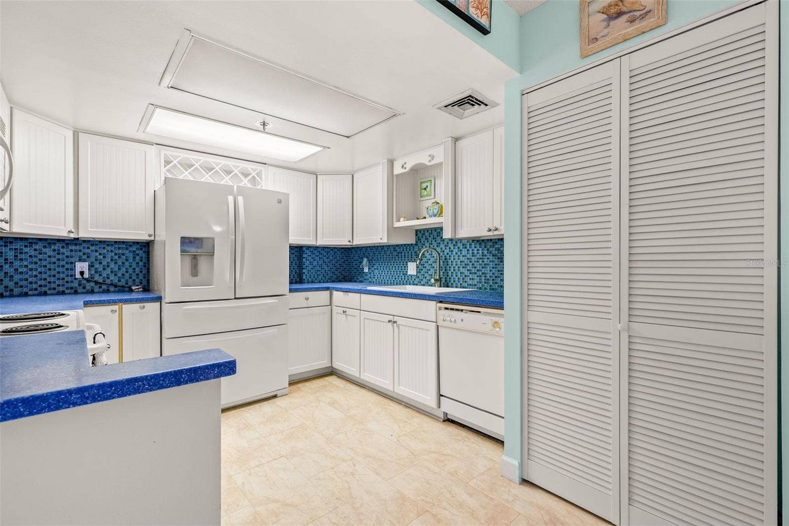 1 KEY CAPRI, #102E, Treasure Island, FL 33706 Doors at Right contain washer - dryer