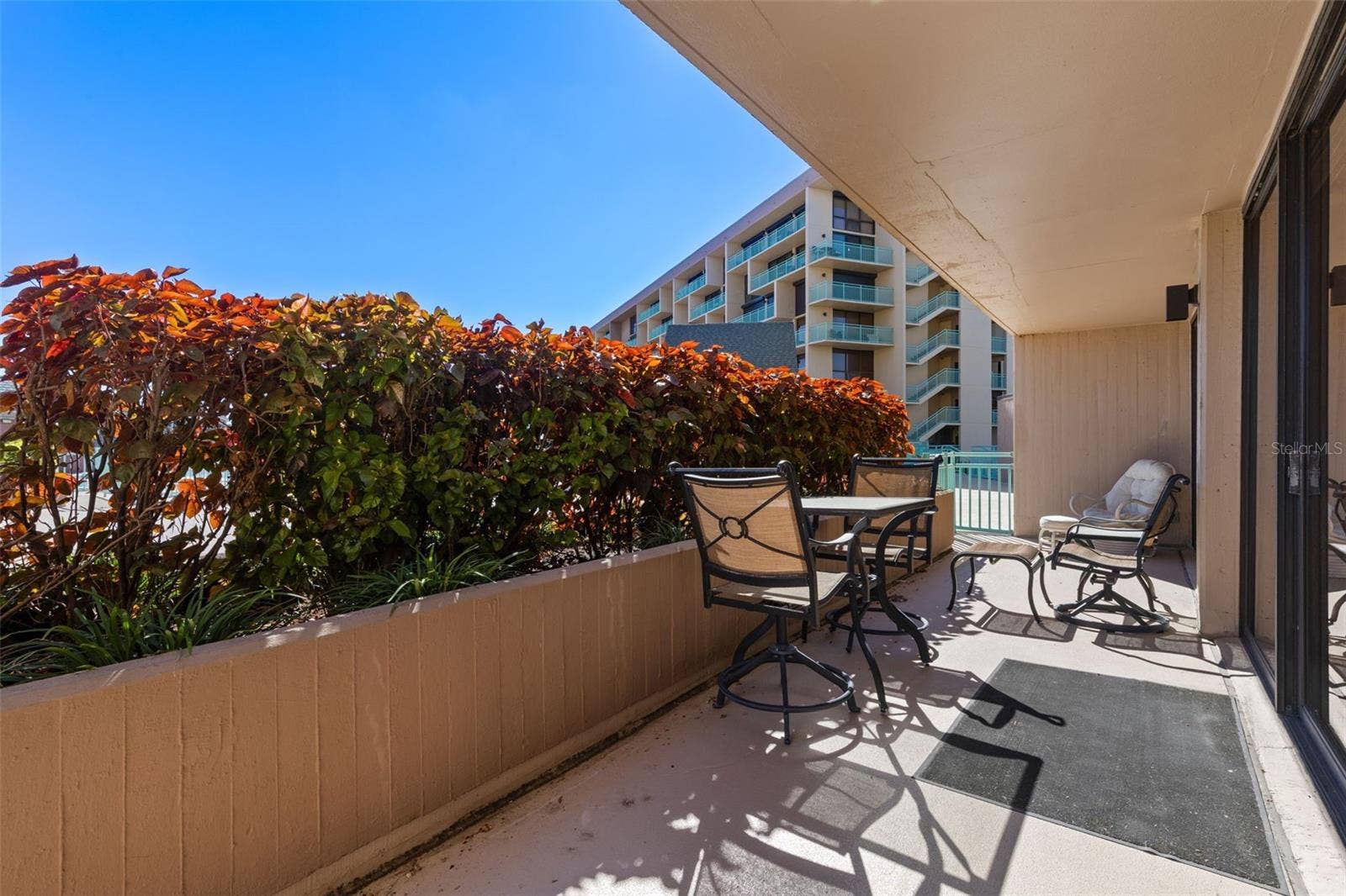1 KEY CAPRI, #102E, Treasure Island, FL 33706 Private Terrace serves BOTH Bedrooms and Living Room - DIRECT access to POOL, Spa and Tiki Hut for Al Fresco Dining Options