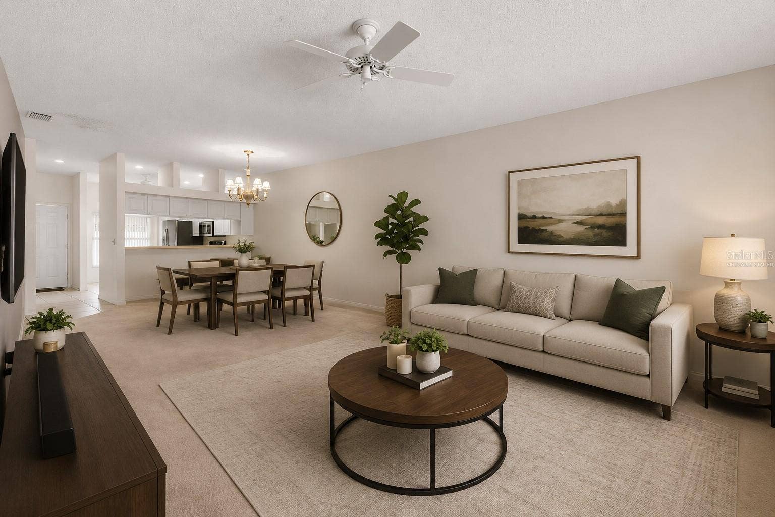 Expansive living room with generous proportions and a versatile layout that easily accommodates multiple seating arrangements or a combined living and workspace setup. This photo has been virtually staged.