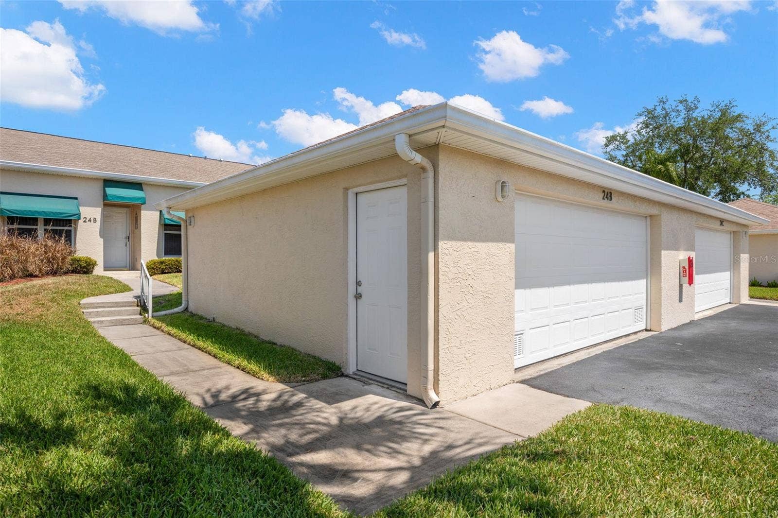 Detached private garage included with the unit, offering secure parking, additional storage, and everyday convenience.