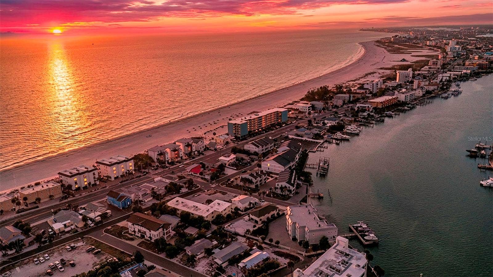 148 98TH AVENUE, Treasure Island, FL 33706 Enjoy epic sunsets and water views to the east and west from 2nd 3rd and rooftop terrace levels of 2 unit