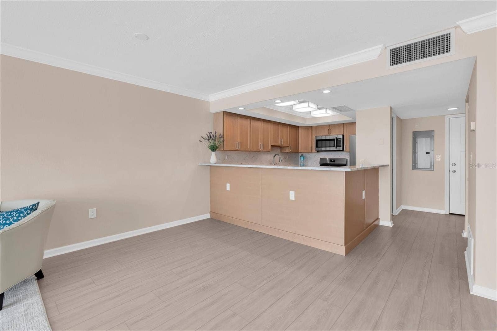 450 TREASURE ISLAND CAUSEWAY, #102, Treasure Island, FL 33706 Living area through kitchen