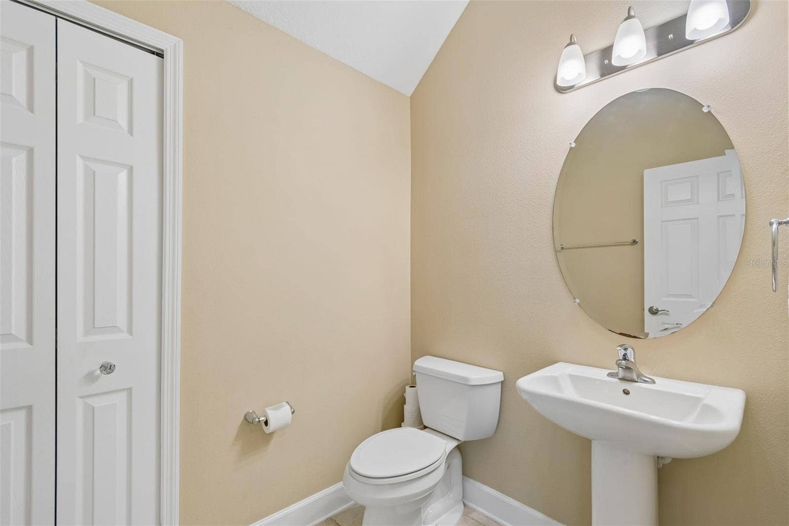 7090 88TH AVE N, Pinellas Park, FL 33782 A well-placed half bath on the first floor offers added convenience for family and visitors alike.