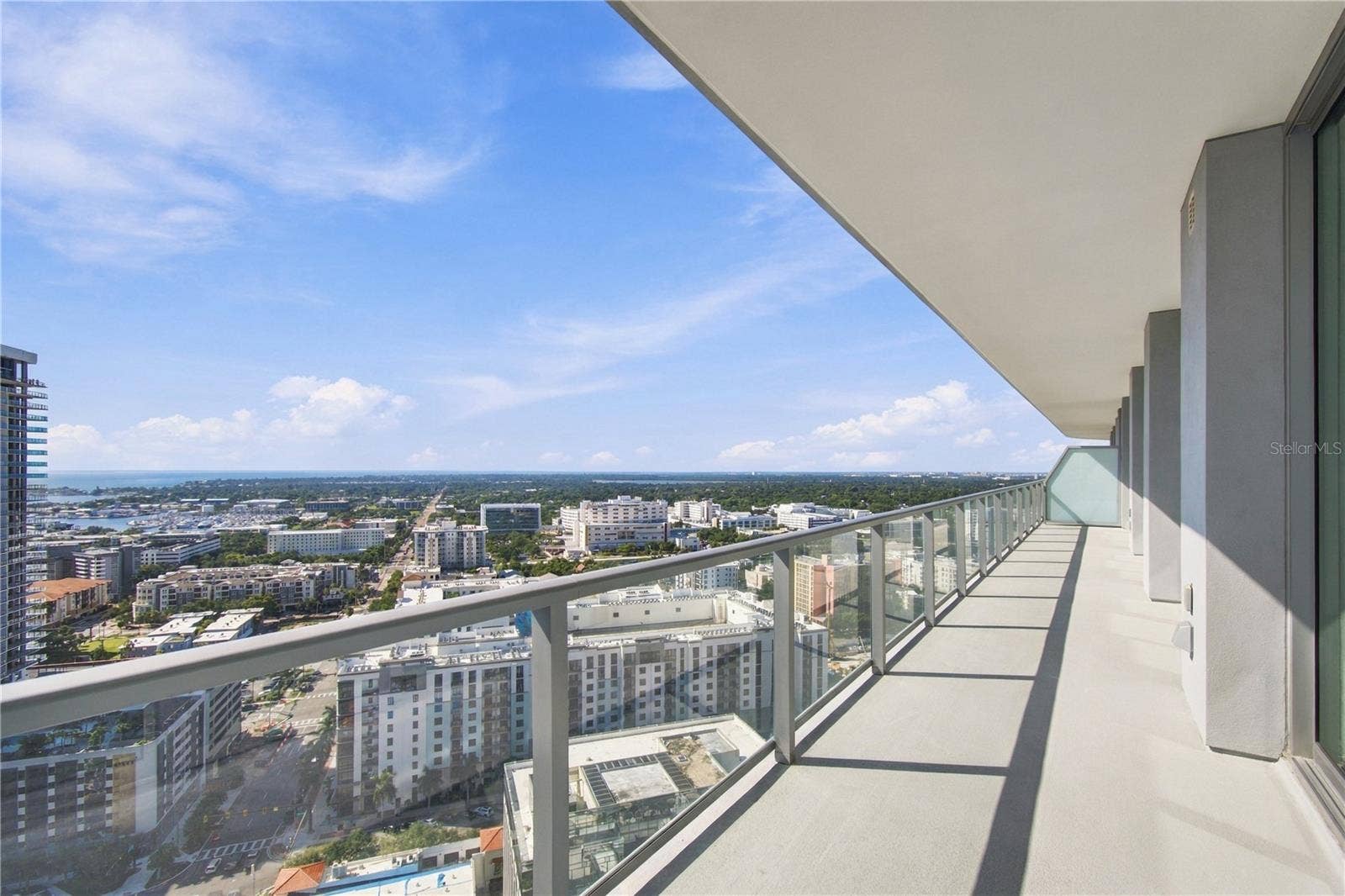 400 CENTRAL AVENUE, #2505, St Petersburg, FL 33701 Due to angle of the building there are views to both the bay and the gulf form the 60 ft balcony