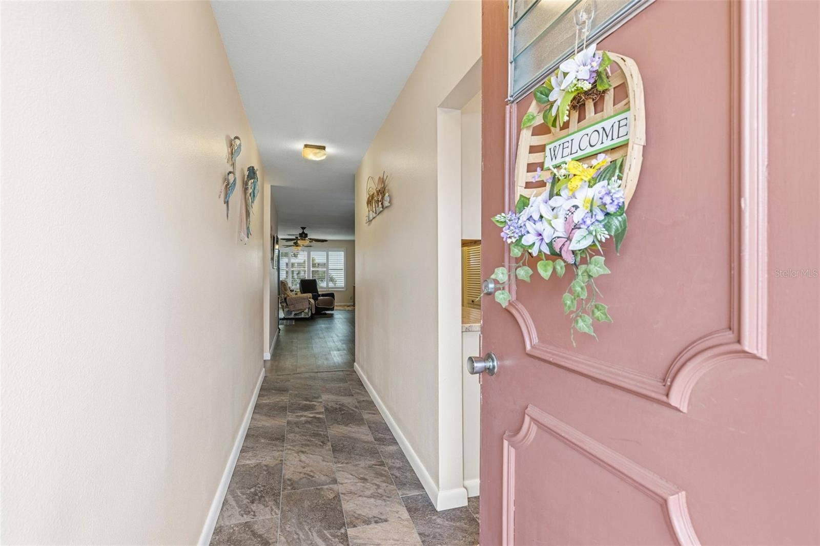 5521 80TH STREET N, #212, St Petersburg, FL 33709 Interior entry hallway with updated flooring