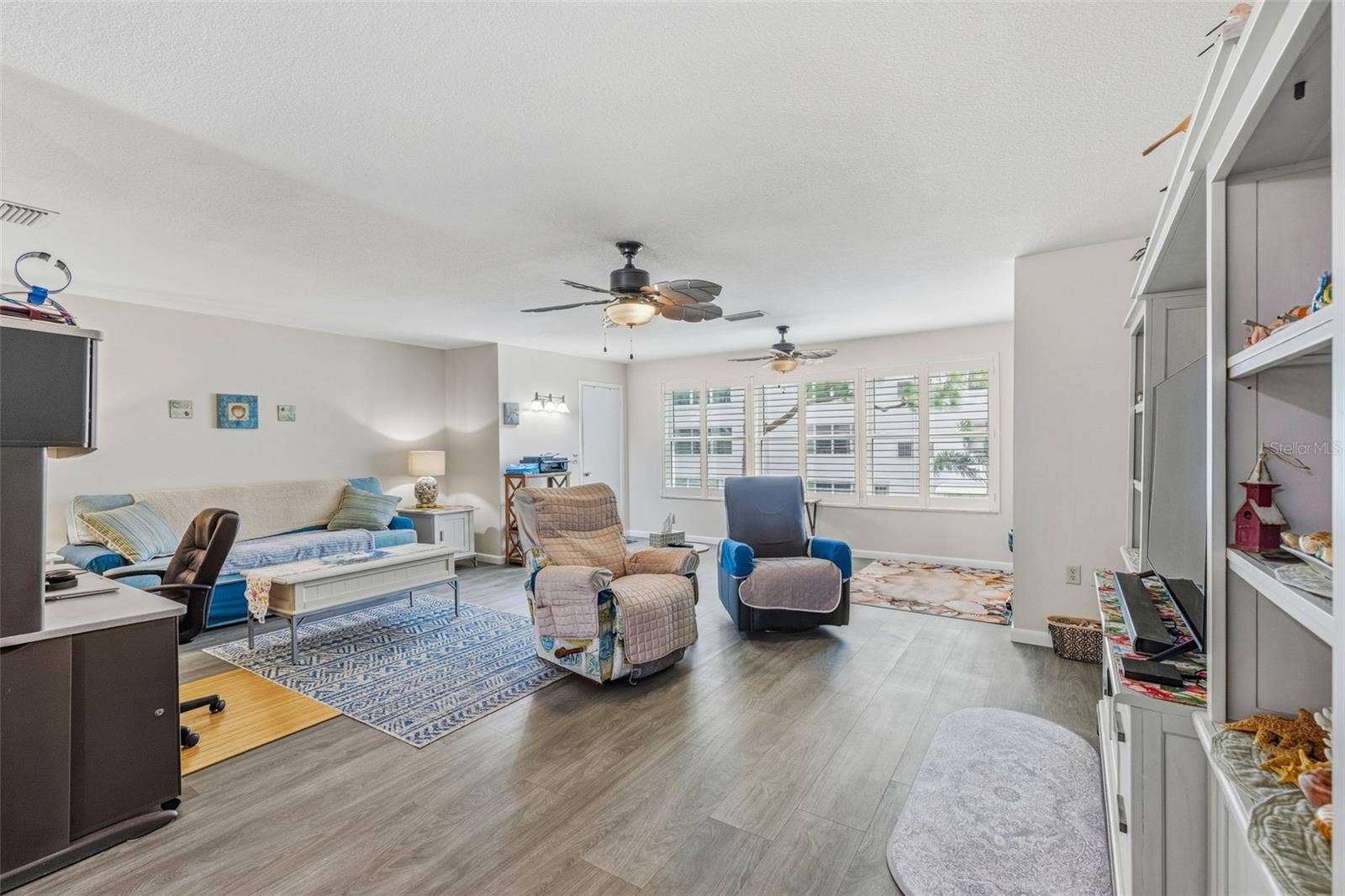 5521 80TH STREET N, #212, St Petersburg, FL 33709 Wide living room with natural light