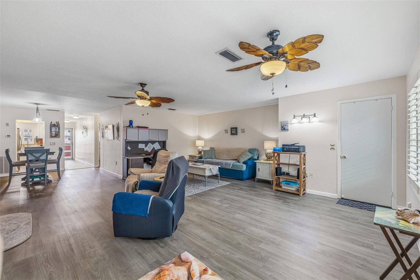 5521 80TH STREET N, #212, St Petersburg, FL 33709 Living room with updated flooring and neutral tones