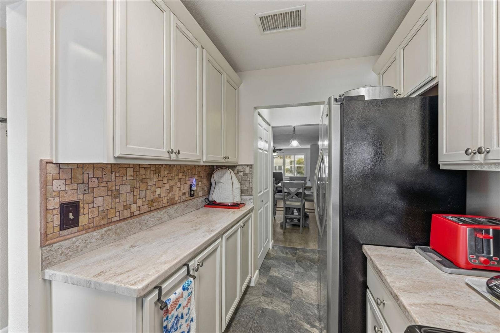 5521 80TH STREET N, #212, St Petersburg, FL 33709 Kitchen with extended counter space and cabinetry