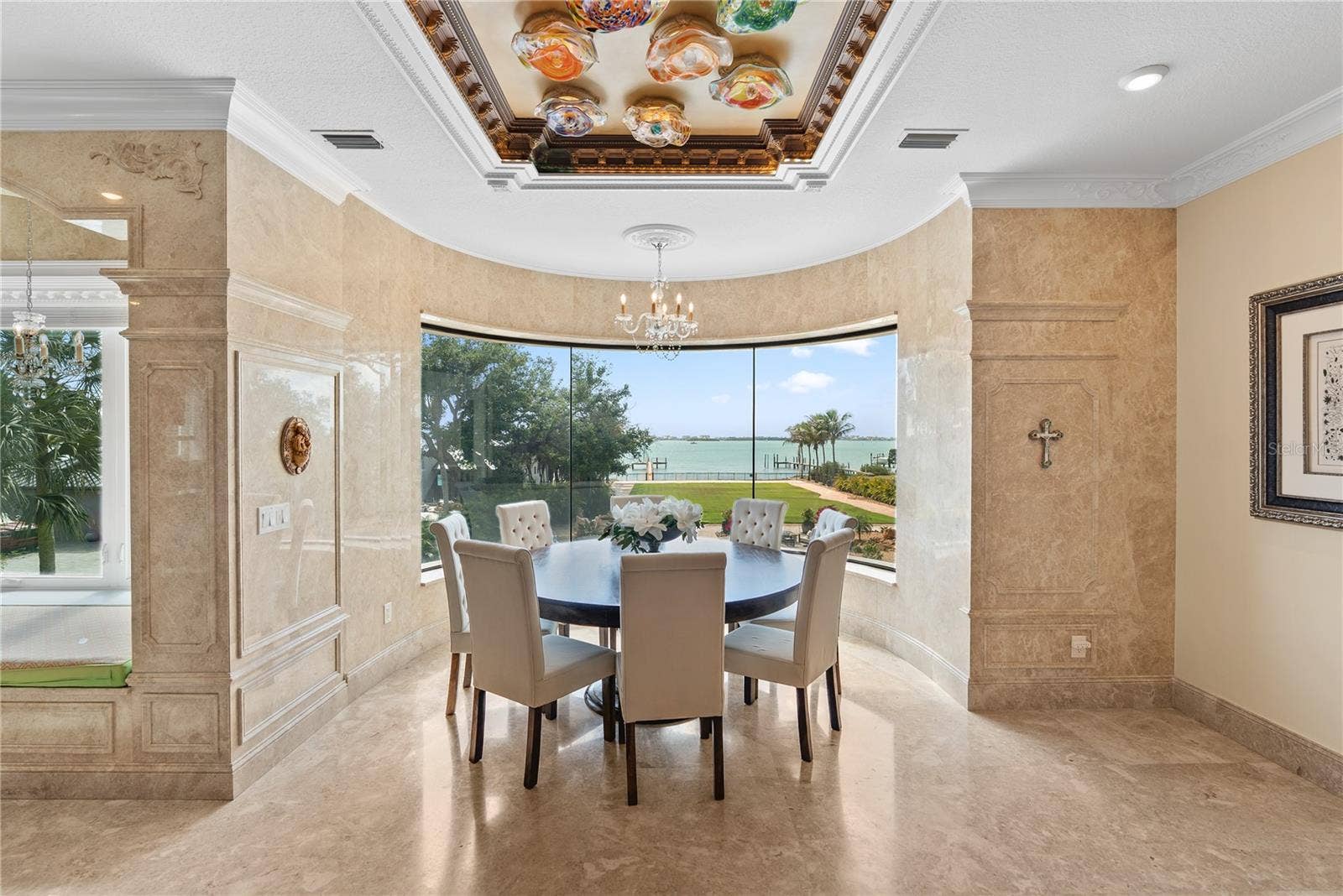2000 PARK STREET N, St Petersburg, FL 33710 Curved glass dining area with panoramic water and pool views.