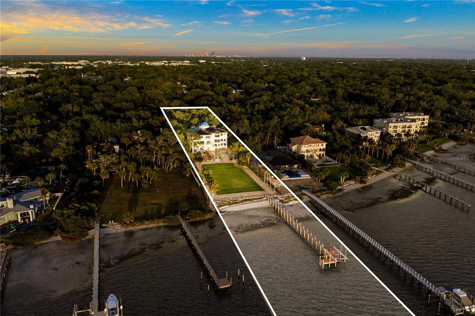 2000 PARK STREET N, St Petersburg, FL 33710 Expansive lawn offering endless possibilities for recreation or future enhancementspickleball, basketball, boathouse, guest house, or greenhouse.