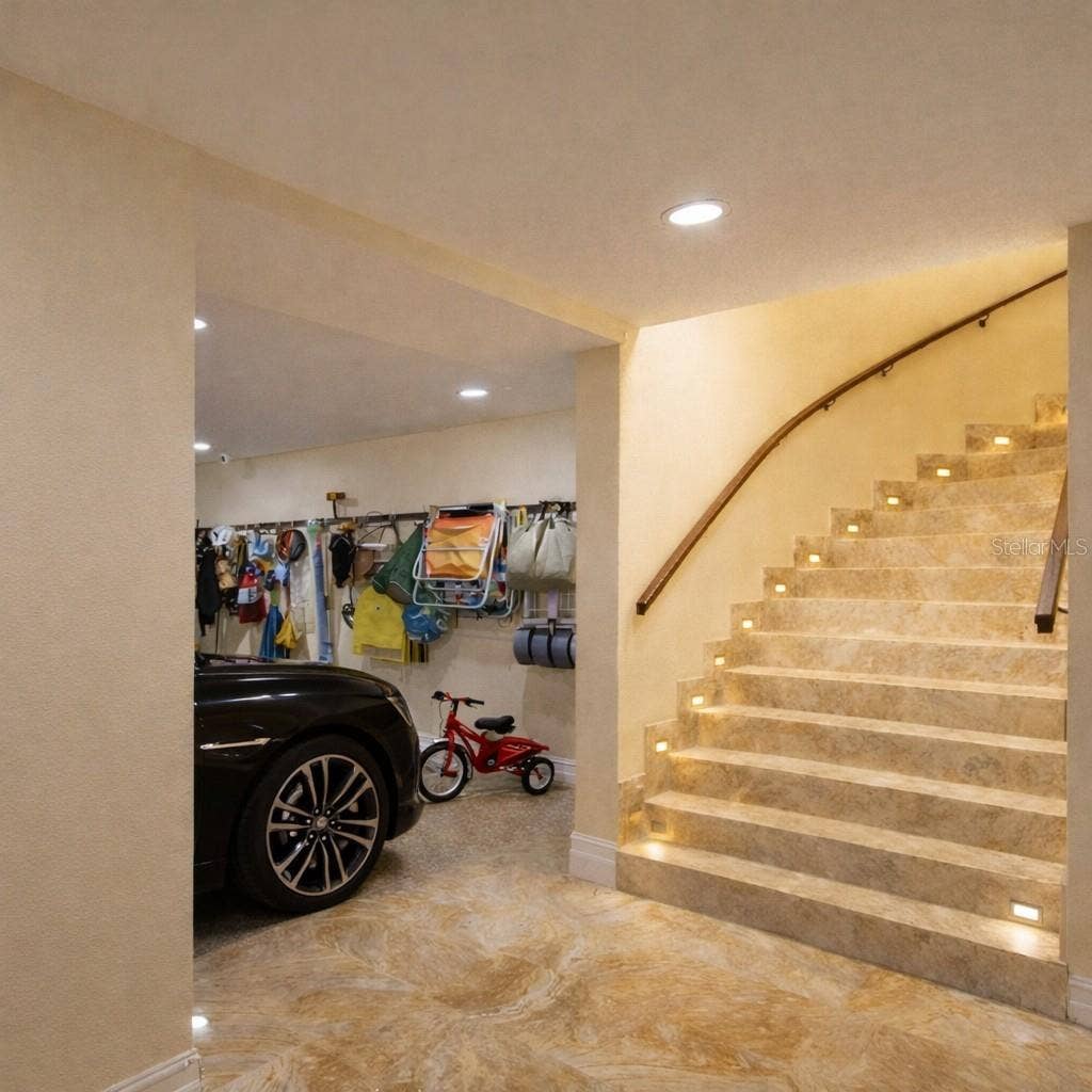 2000 PARK STREET N, St Petersburg, FL 33710 A sweeping marble staircase reveals over 5,000 sq ft of additional living and entertaining space below.