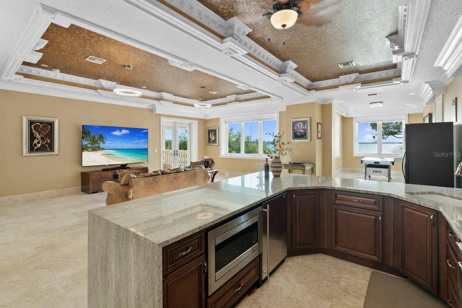 2000 PARK STREET N, St Petersburg, FL 33710 Quartzite full bar with microwave, a Scotsman specialty icemaker and large full screen TV with breathtaking sunset views and a balcony overlooking the pool and Boca Ciega Bay