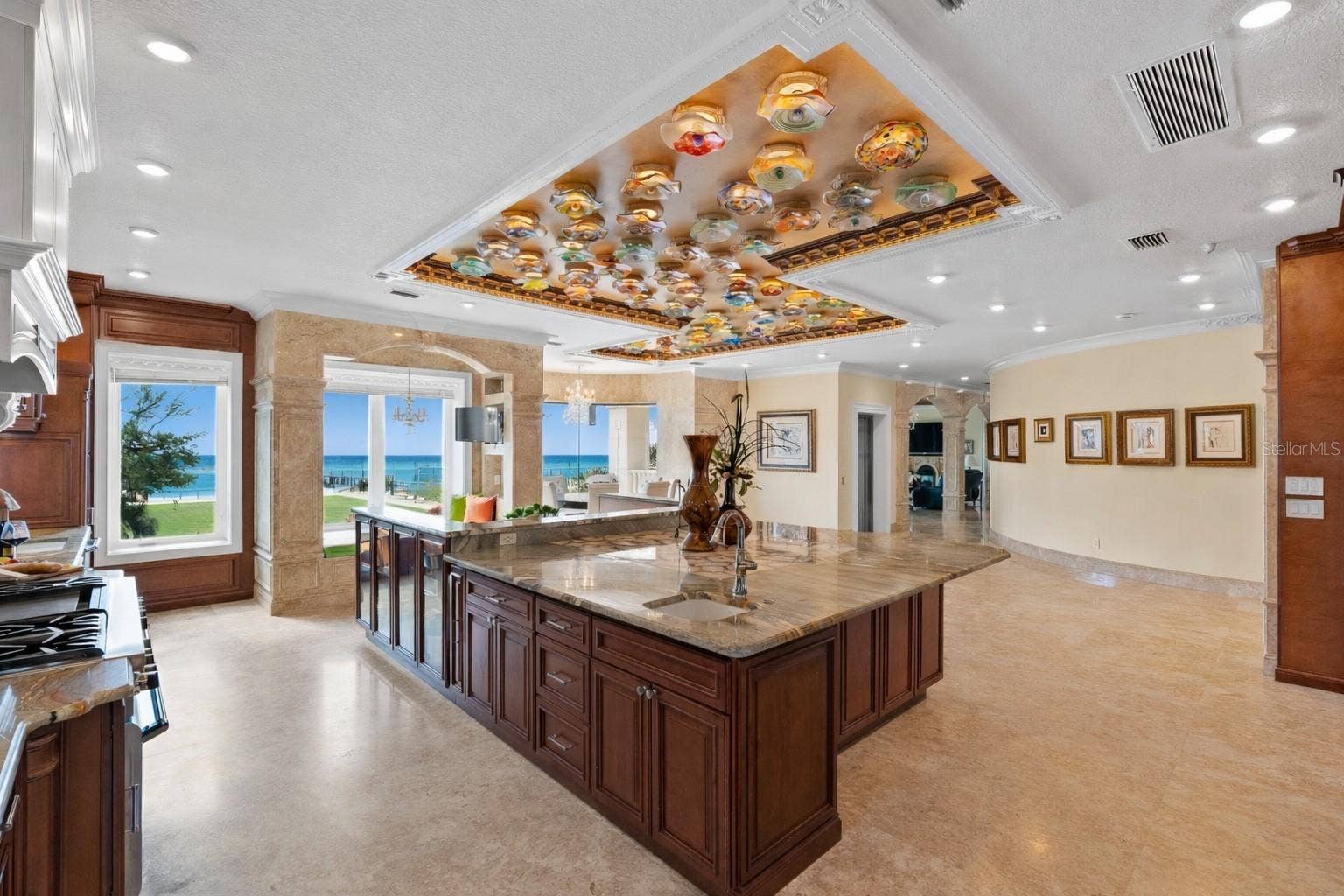 2000 PARK STREET N, St Petersburg, FL 33710 Chefs kitchen with a full suite of Thermador appliances and statement onyx island.