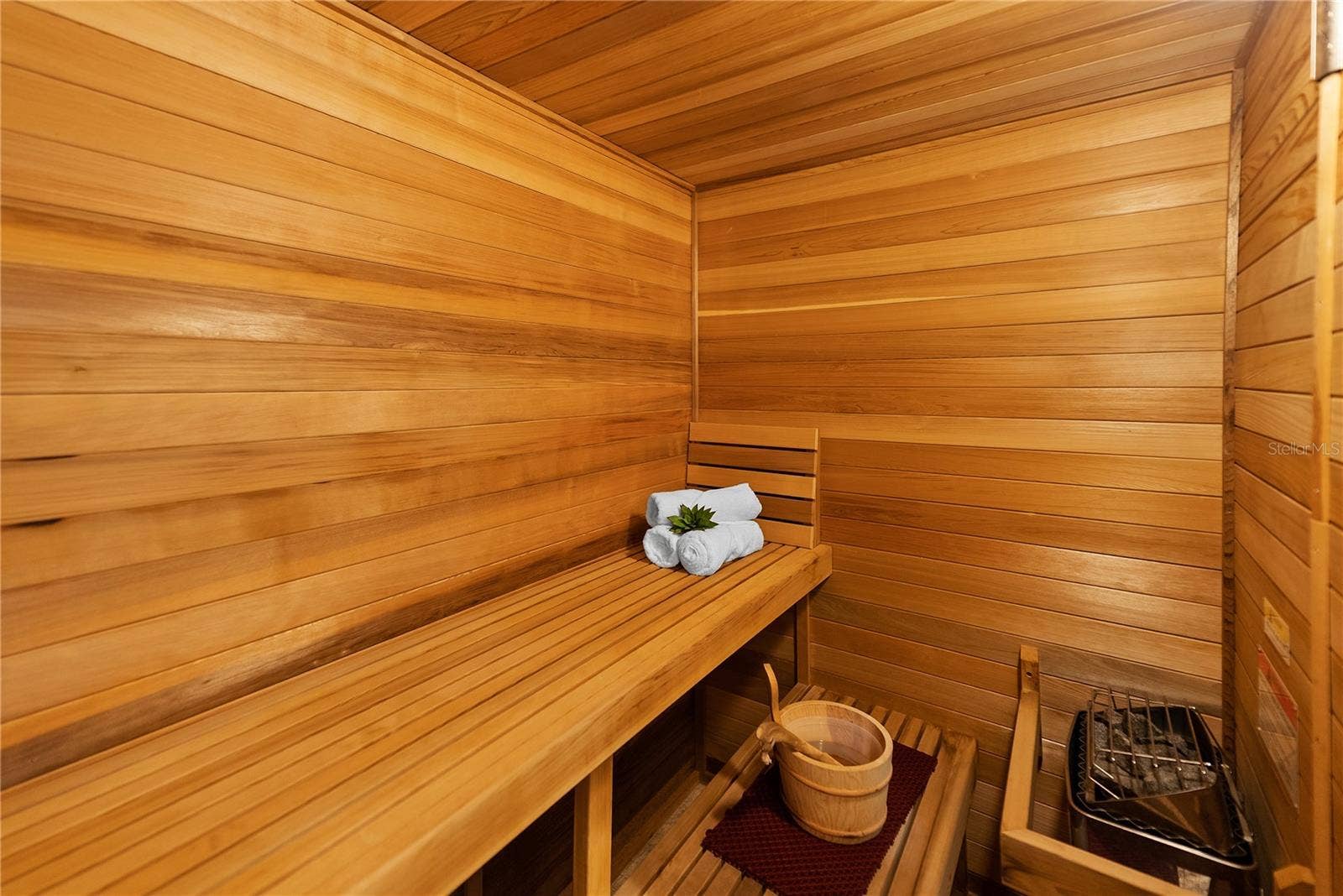 2000 PARK STREET N, St Petersburg, FL 33710 Expansive cedar sauna in the primary suite, designed for a true at-home wellness experience.