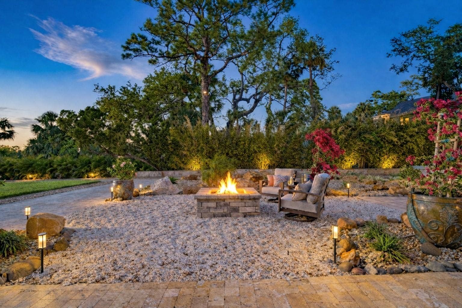 2000 PARK STREET N, St Petersburg, FL 33710 A glowing firepit sets the stage for unforgettable evenings by the water.