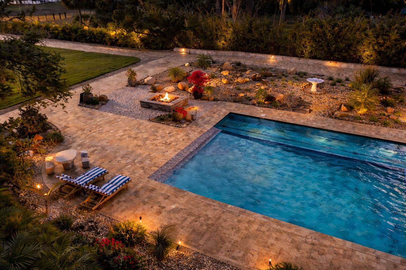 2000 PARK STREET N, St Petersburg, FL 33710 Resort-style pool and spa illuminated for unforgettable evenings under the stars.