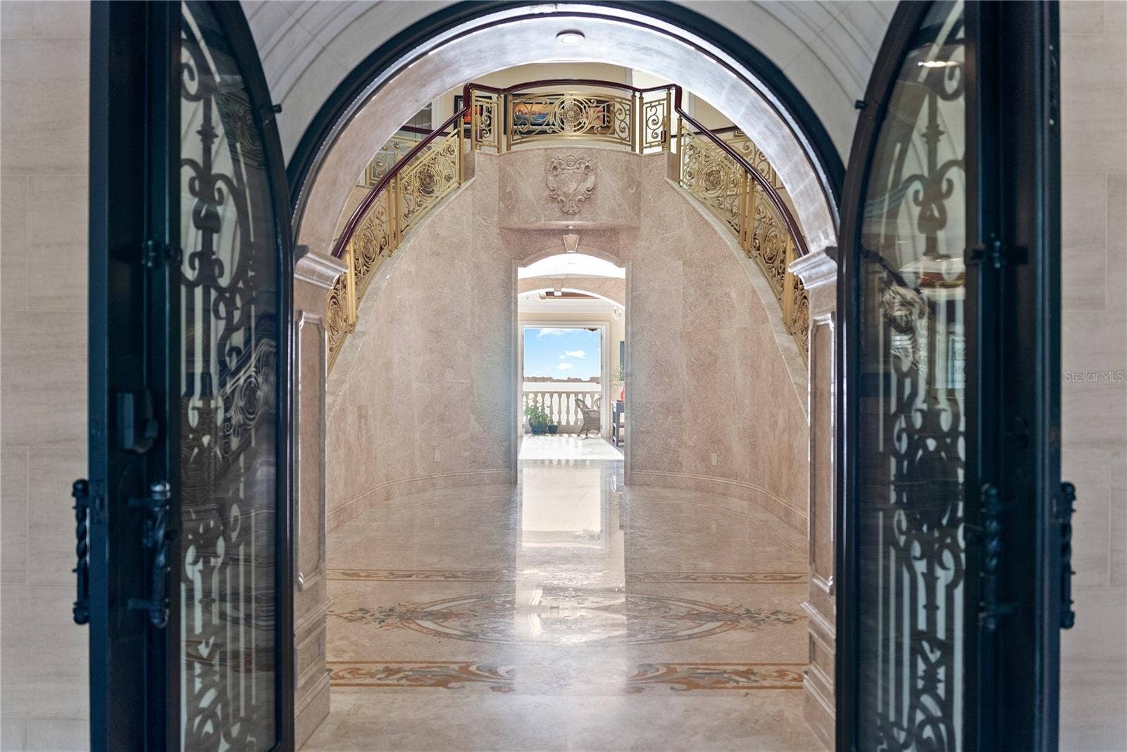 2000 PARK STREET N, St Petersburg, FL 33710 Arched Iron doors welcome you to Palazzo Sul Mare! Opens to water views and a gallery corridor designed for art display and dramatic transitions between spaces.