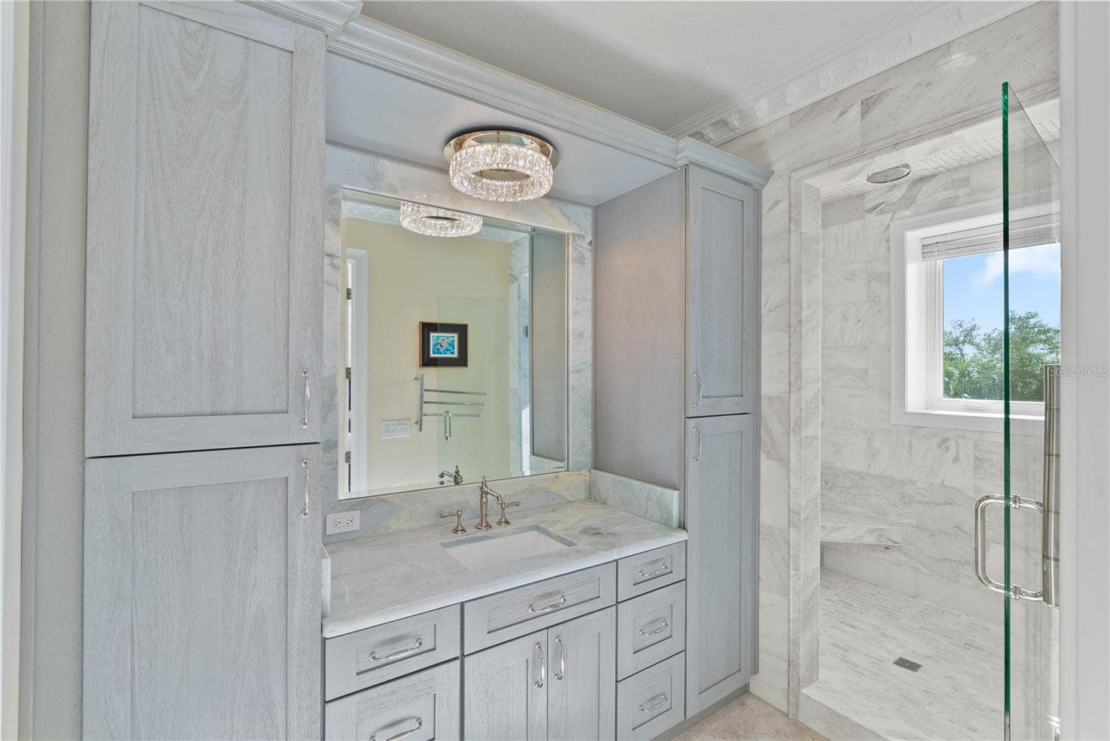 2000 PARK STREET N, St Petersburg, FL 33710 Elegant marble bath with refined finishes and spa-inspired design.
